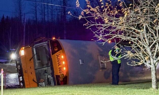 Mat-Su school bus carrying 9 students tips over on icy road; no serious injuries reported